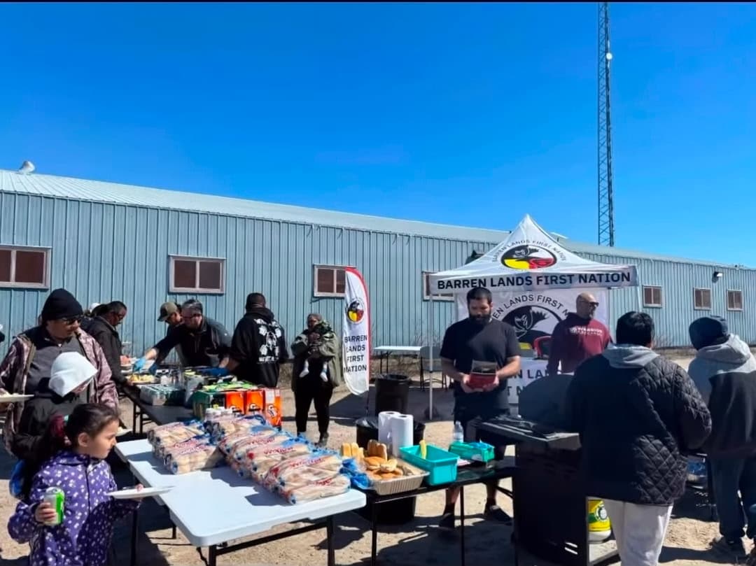 Cole Smith serving the community at a Barren Lands First Nation event